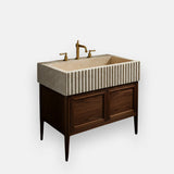 double door vanity with fluted travertine sink