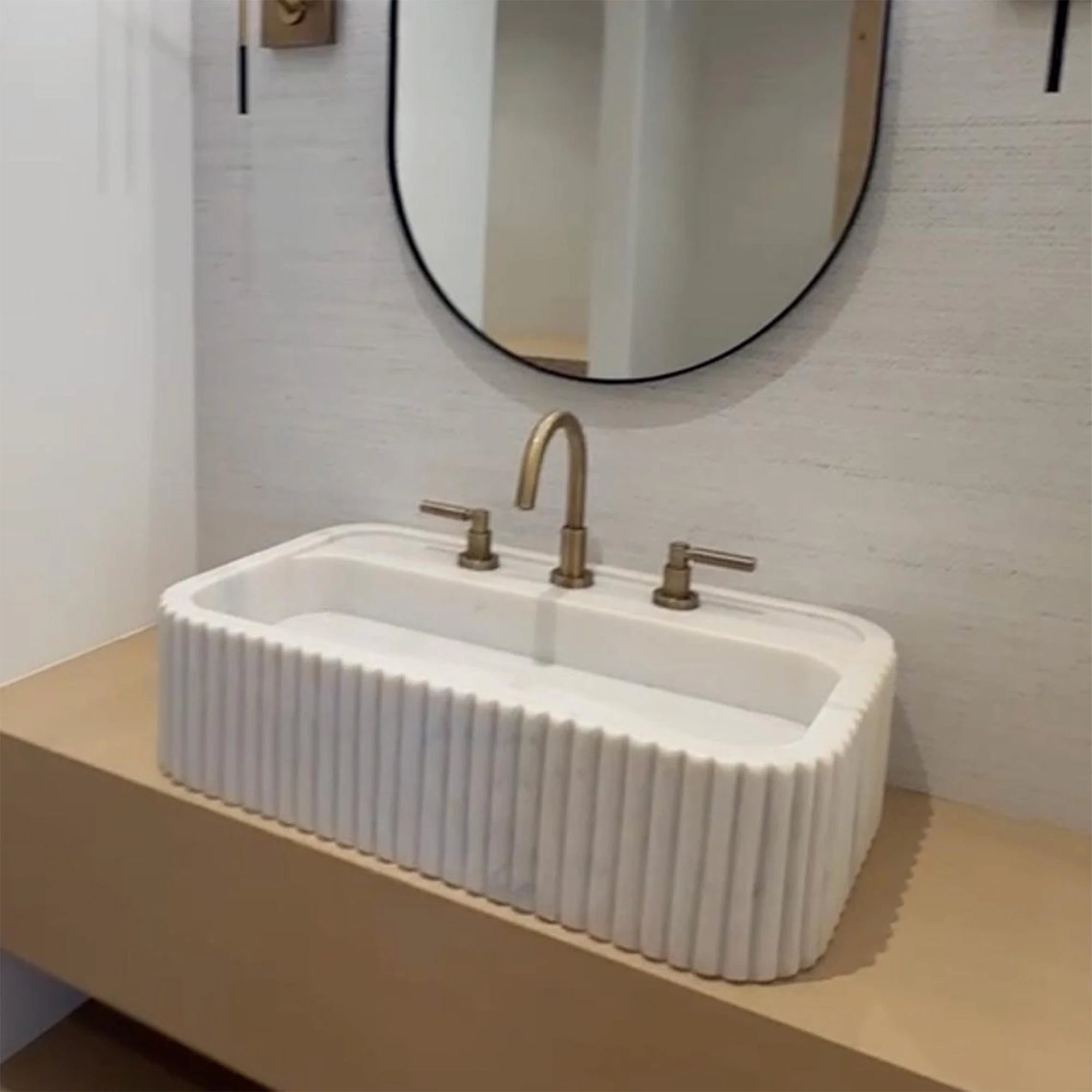 floating vanity with handcrafted marble basin