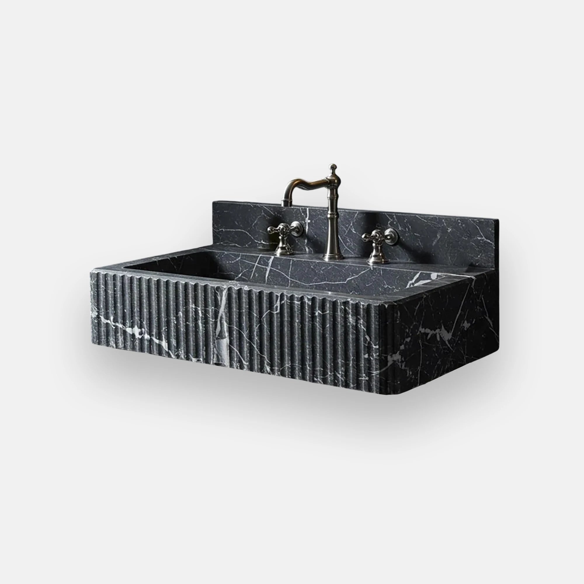 Fluted black marble vanity sink with striking white veining and elegant gold hardware, offering a luxurious centerpiece for contemporary bathroom designs.