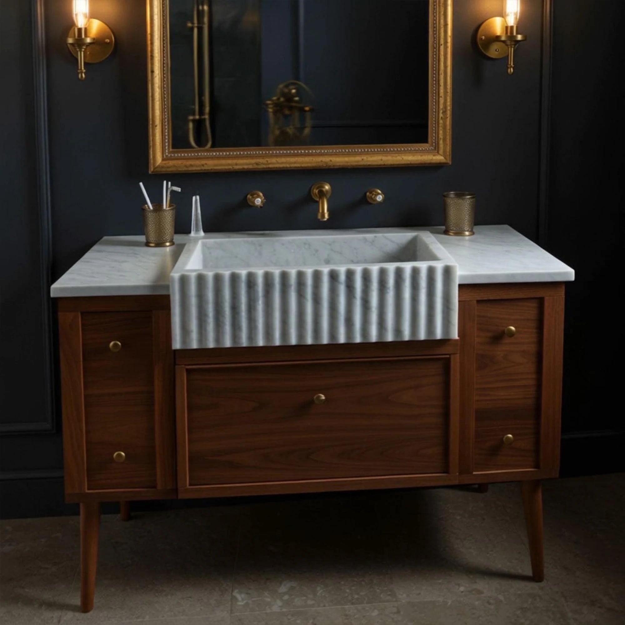 fluted marble sink with walnut vanity and brass hardware
