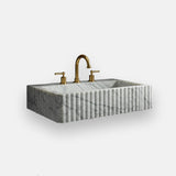 subtle veined carrara marble fluted wall sink