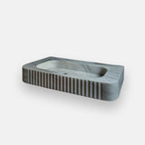 wall mounted carrara marble sink with fluted front
