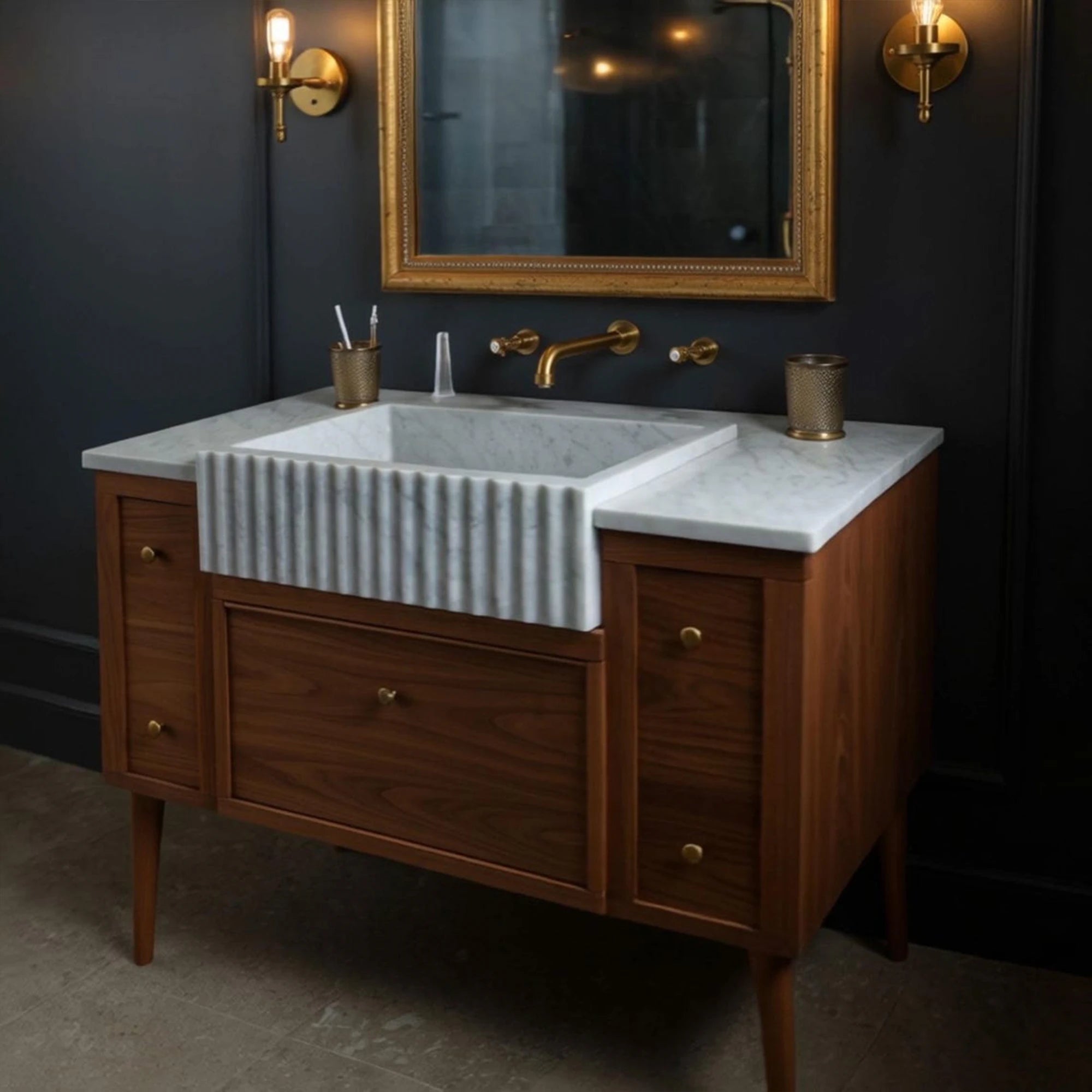 walnut and marble vanity with fluted sink and brass fixtures